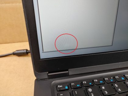 **NO POWER ADAPTER / NO BATTERY INSTALLED/ NO SSD **  There is a tiny crack in the back corner of the laptop (View image 8). There is also a tiny faint pressure mark in the bottom left of the LCD (View image 9). Tested and Working as it should. Boots to the BIOs. May have a few minor cosmetic scratches/scuffs. For your help