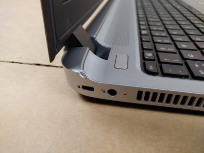 **NO POWER ADAPTER INCLUDED** There is some cosmetic blemishes on the left side of the laptop