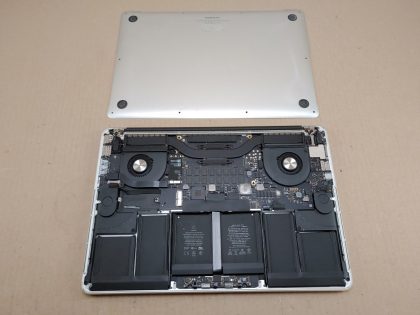 System powers on and boots off an external drive. No SSD Drive. We have not attempted to install a ssd and see if the system will boot off the internal drive. Screen is cracked as shown in the images. Camera cable port on the logic board is broke off