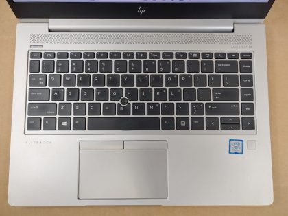 There is a thin scratch at the bottom of the screen (View image 9). There is a little paint flaked off by the space bar and between some keys (View image 10). 2 Rubber feet are missing on the bottom