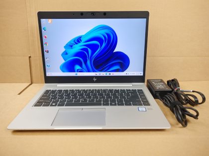 There is a thin scratch at the bottom of the screen (View image 9). There is a little paint flaked off by the space bar and between some keys (View image 10). 2 Rubber feet are missing on the bottom