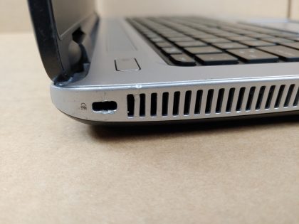 **NO OS / NO POWER ADAPTER** The screen has some wear from the keyboard (View image 8). There is a cosmetic chip in the front corner