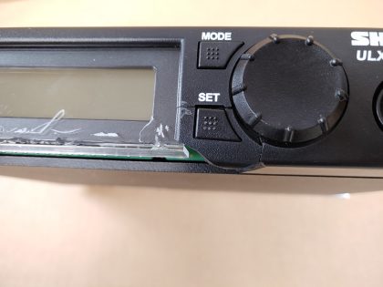 Tested and working as it should. The bottom housing under where the screen is broken off as well as the plastic around the SET button is cracked so the plastic button will fall off. Looks like the bottom of the screen is slighty damaged. **NO POWER ADAPTER INCLUDED** Item Specifics: MPN : ULXP4UPC : N/ABrand : SHUREType : Microphone ReceiverModel : ULXP4Connectivity : WirelessMicrophone Form Factor : Microphone Receiver - 3