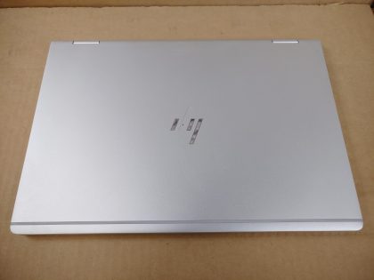 glass is good and not cracked (View image 9). There is also 2 cosmetic cracks in the bottom plate (View image 10). The middle of the HP logo on the top is missing (View image 6). Fully Tested & 100% Functional ready to use out of the box