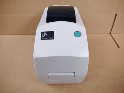 Good condition! Tested and pulled from a working environment! **NO POWER ADAPTER OR CABLES INCLUDED**Item Specifics: MPN : TLP 2824 PlusUPC : N/ATechnology : Thermal TransferPrinter Type : Label BarcodeOutput Type : Black and WhiteBrand : ZebraModel : TLP 2824 PlusProduct Line : Zebra TLPResolution : 203dpiInterface : Serial