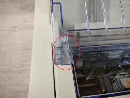 The clear tray is cracked on the right side (View image 10). The tab that hooks in on the left side of the clear try is broke off