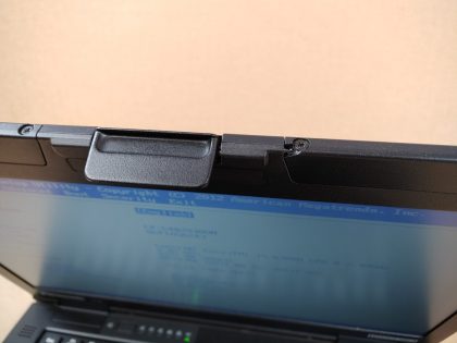 **NO OPERATING SYSTEM** There looks to be some speckles of over spray from paint thats on the palmrest and screen (View images 9 & 10). Theres a small piece of plastic broke next to the handle (View image 11). Tested and Working. Boots to the BIOs. May have a few minor cosmetic scratches/scuffs. For your help