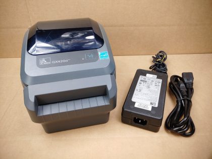 Good Condition! There is some minor scratches/scuffs from normal use. Tested and pulled from a working environment! **POWER ADAPTER INCLUDED**Item Specifics: MPN : GX420dUPC : N/ATechnology : ThermalPrinter Type : Direct ThermalOutput Type : Black / WhiteBrand : ZebraModel : GX420d / GX42-202412-000Product Line : Zebra GBlack Print Speed : Up to 6"/152 mm per secondType : Label PrinterScanning Resolution : 203 dpi (8 dots/mm) - 1