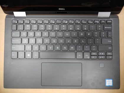 There is signs of liquid spill on the board (View image 8). The touchpad click does not work. The right shift key is stuck down and not springy. Missing all screws to the bottom plate. Screen is in good condition