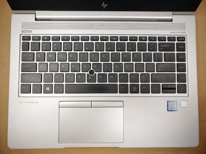 **NO POWER (DOA). LAPTOP DOES NOT POWER. The top left corner of the screen bezel is damaged