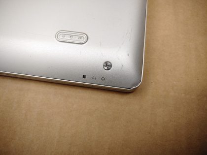 **NO POWER (DOA). LAPTOP DOES NOT POWER. The top left corner of the screen bezel is damaged