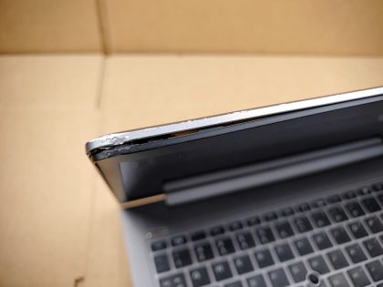 There is a small crack in the top corner of& ;the lid (View images 9 & 10). Both top corners of the screen bezel are separated from the lid a little from being damaged (View image 11). There i some some very minor screen wear from the keyboard. Tested and Working. Boots to the BIOs. May have a few minor cosmetic scratches/scuffs. For your help