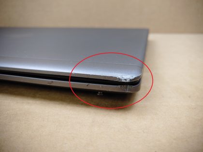 Both front corners on the palmrest and lid are damaged