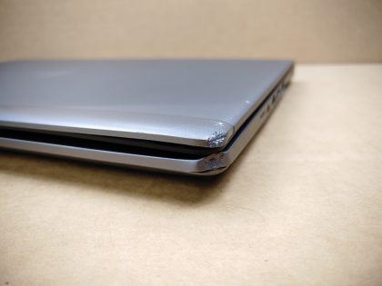 The front right corner of the Lid/Palmrest/Bottom plate is dented/damaged (View images 9-11). Bottom plate is missing one screw. Tested and Working. Boots to the BIOs. May have a few minor cosmetic scratches/scuffs. For your help