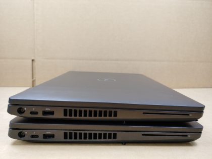 LOT of 2 - One laptop has a small faint pressure mark in the bottom right corner (View image 4). Tested and Working. Boots to the BIOs. May have a few minor cosmetic scratches/scuffs. For your help