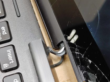 The hinge is broke out of the inside of the lid (View image 9). The glass is cracked as well
