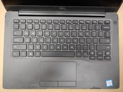 The laptop is covered in over spray from white paint (View image 4 & 5) The screen has wear and scuffs from the palmrest/keyboard