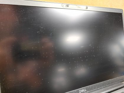The laptop is covered in over spray from white paint (View image 4 & 5) The screen has wear and scuffs from the palmrest/keyboard