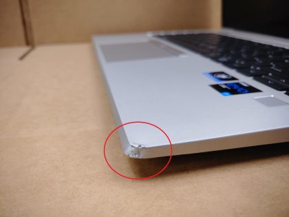 There is a small spot in the top right corner of the screen where its cracked and the corner of the lid it damaged (View images 8 & 9). Right corner of the palmrest is slightly blemished (View image 10). There is also a tiny piece of the vent that you dont see with the base on that broke (View image 11). Screen has 2 tiny lines of wear from the keyboard. **FACTORY WARRANTY TILL AUGUST 7