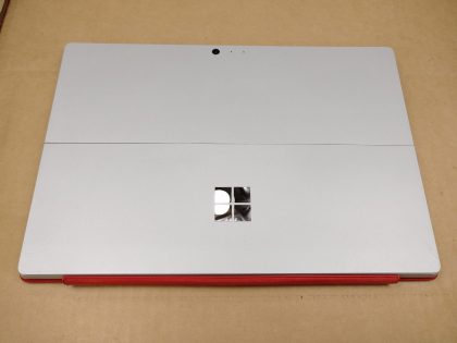 There is a small spot of very light wear from the touchpad. There is a super faint pressure mark in the bottom middle of& ; the screen. Fully Tested & 100% Functional ready to use out of the box