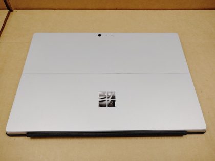 There is a very faint small wear spot on the screen from the touchpad. Fully Tested & 100% Functional ready to use out of the box