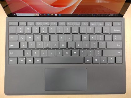 **NO POWER ADAPTER INCLUDED** There is a very light spot of wear from the touchpad