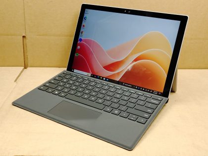 **NO POWER ADAPTER INCLUDED** There is a very light spot of wear from the touchpad