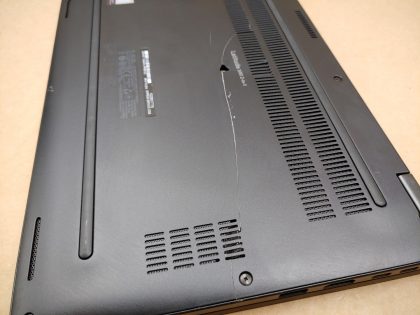 There is some very faint tiny specks of wear on the screen from the keyboard. The bottom plate is cracked all the way in half
